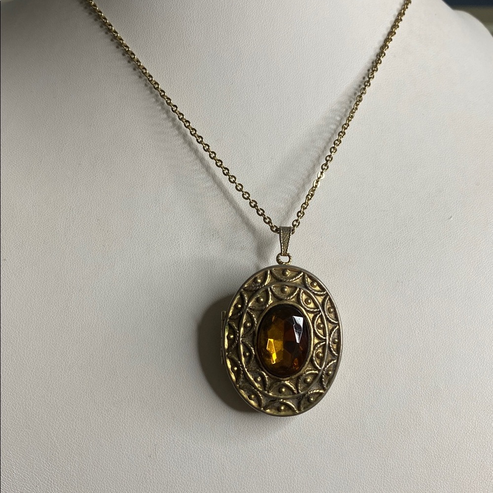 AVON Locket perfume Locket pendant/Brooch with Amber colored Gem.